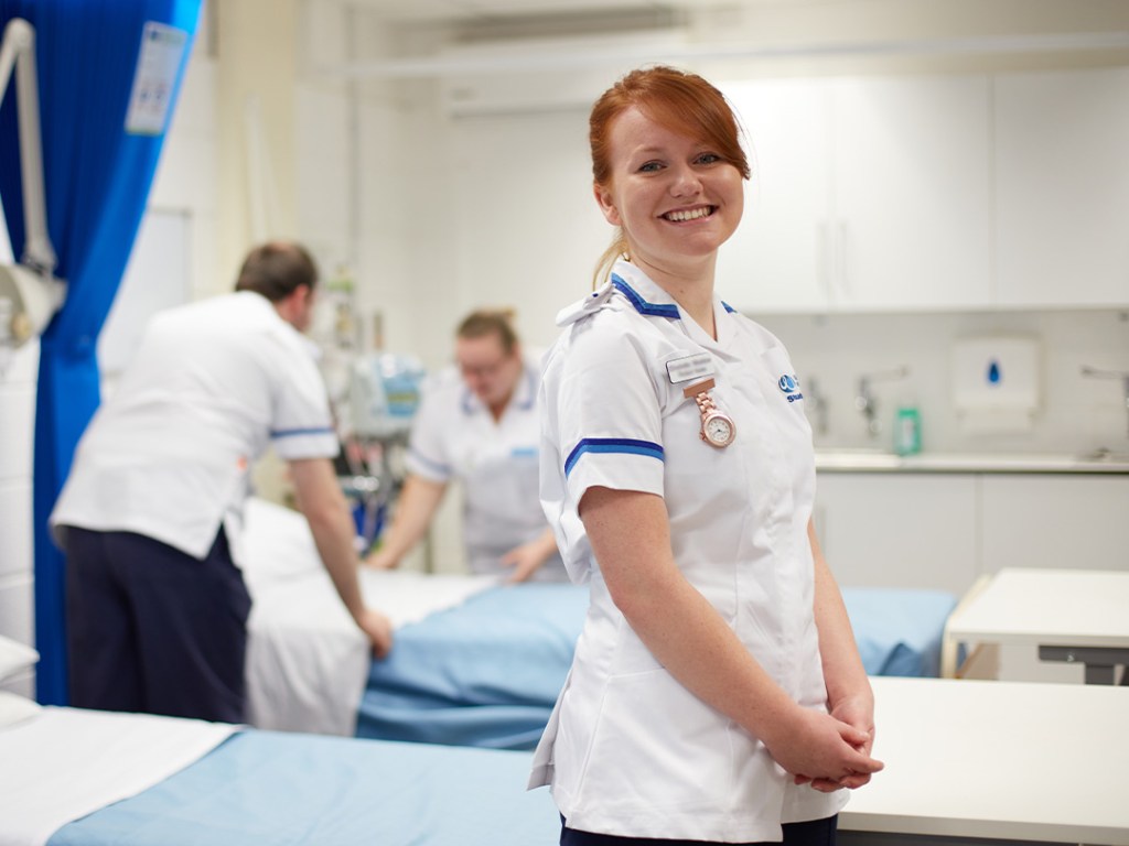 A student nurse in a mock hospital ward