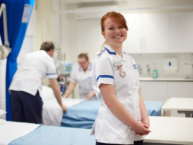 A student nurse in a mock hospital ward